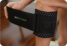 Older person wrapping the BeActive® Plus Silver around their knee